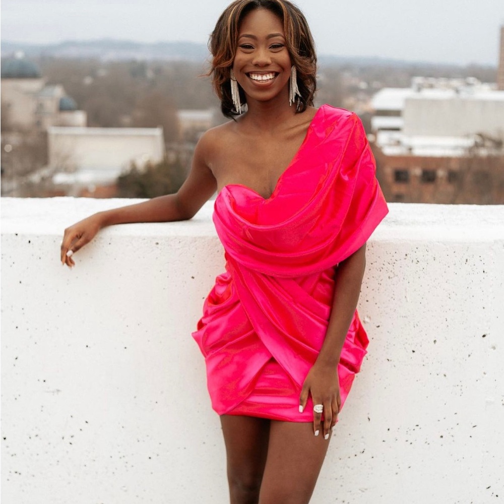 Pink satin cocktail dress. Size 2 but could fit a 4. Worn once.